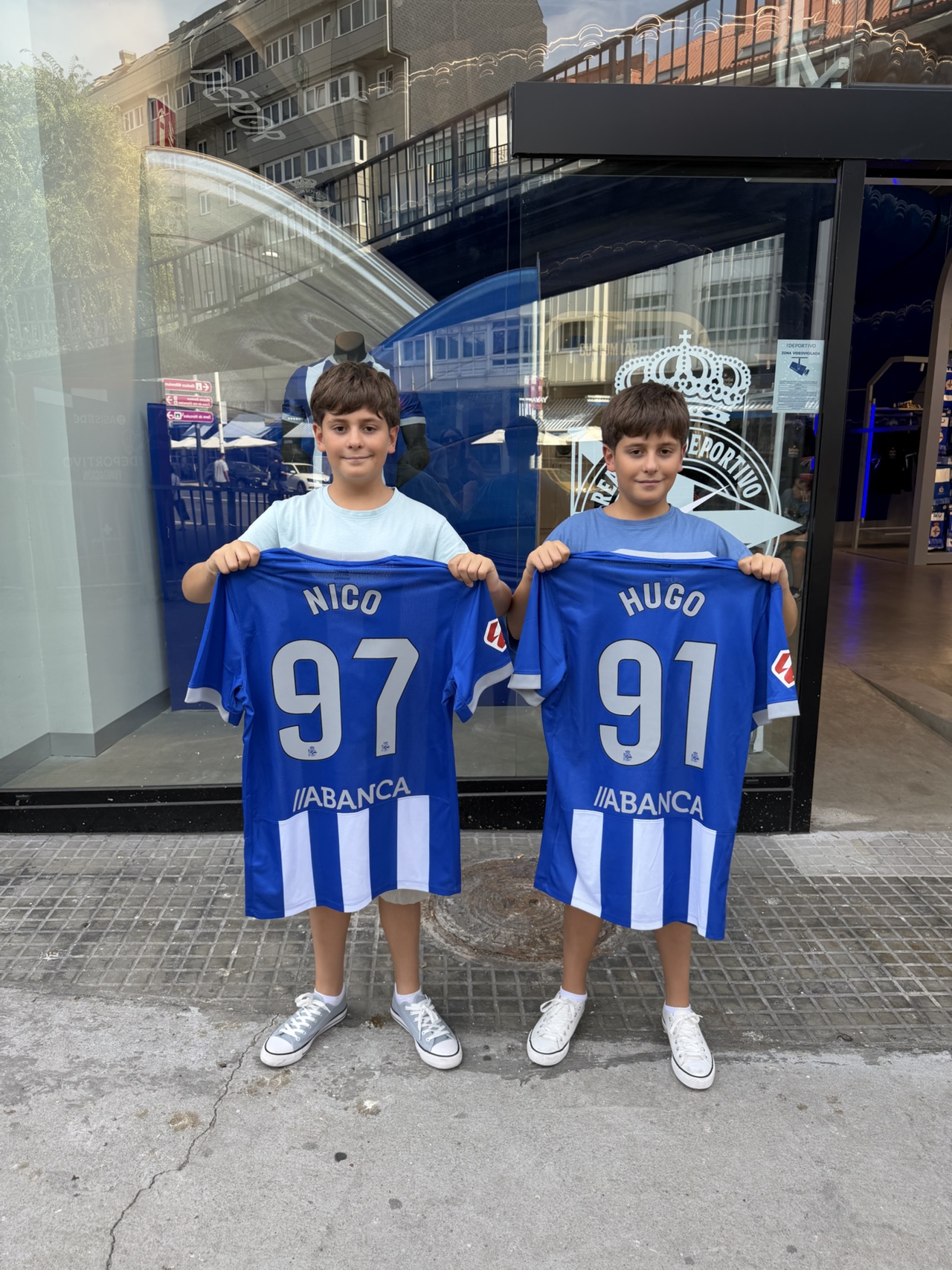 Kids wearing Deportivo shirts